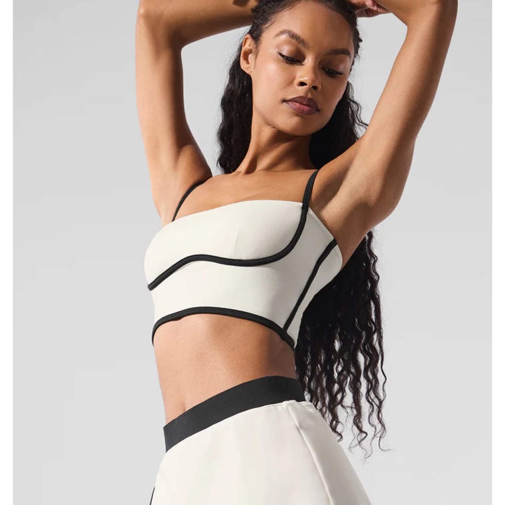 ALO Yoga Cream and Black Bra with Modern Design